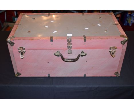 A MILITARY STYLE TRUNK CONTAINING A RANGE OF UNIFORMS FROM VARIOUS ERAS AND COUNTRIES, this lot includes two white Royal Navy