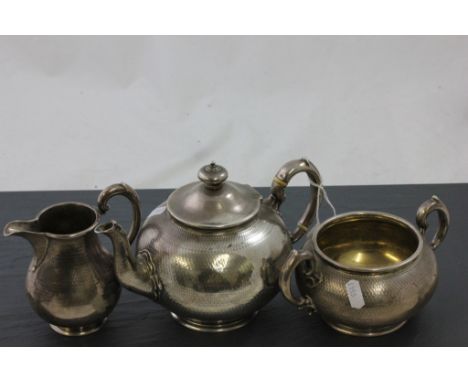 Victorian Silver Three Piece Tea Service comprising Teapot, Sugar Bowl and Milk Jug, each piece with complete chased decorati