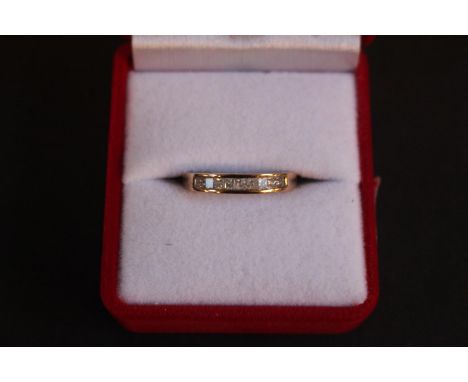 Ladies 9ct Gold Diamond channel set 1/2 Eternity ring. Set with nine Princess cut Diamonds. 3g total weight Size O 