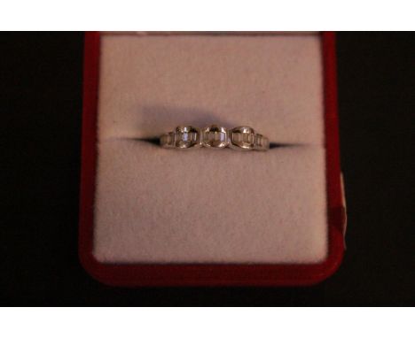 Ladies 18ct White Gold Diamond set ring with Baguette channel set stones. 3.4g total weight. Size N 
