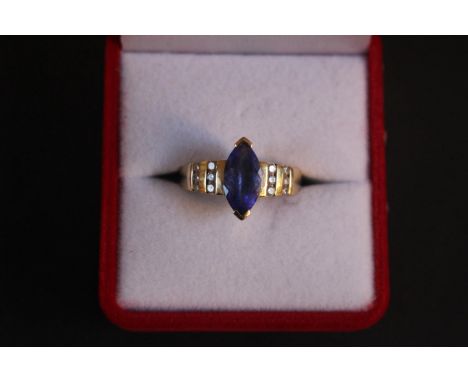 Good quality Ladies Tanzanite and Diamond set ring. 2.2ct Marquise set with Diamond set shoulders. 4.9g total weight. Size N 