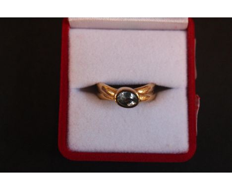 Ladies 9ct Gold ring set with Oval Aquamarine in bezel setting. 5.6g total weight. Size Q 