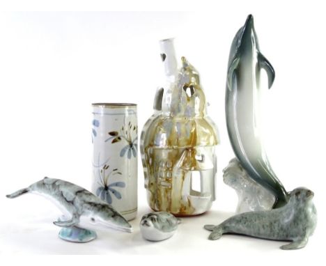 Miscellaneous studio pottery, to include dolphins, seals, an unusual tea light burner, and a Royal Dux figure of a dolphin. (