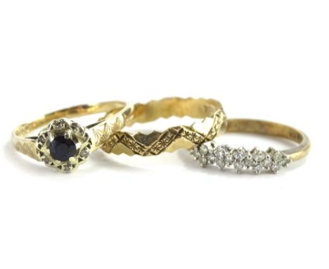 Three 9ct gold dress rings, to include a daisy cluster ring, a half hoop eternity ring, and a cross hatch design engraved wed