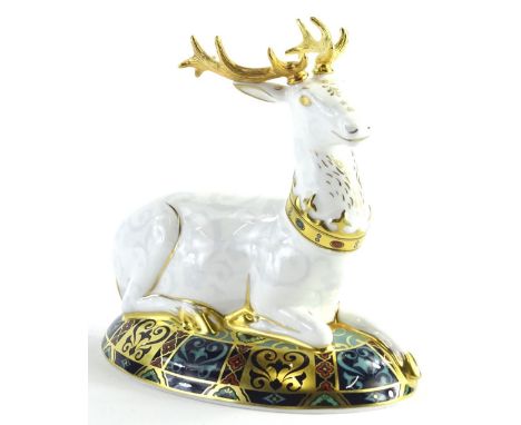 A Royal Crown Derby porcelain white heart paperweight, gold button to underside, limited edition no. 1681 of 2000, boxed.