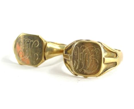 Two 9ct gold signet rings, one bearing the initials TM, with pierced design shoulders, ring size T½, the other bearing the in