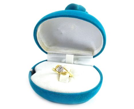 An 18ct gold diamond set floral ring, the diamond in illusion platinum setting, with curved leaf to each side, ring size N½, 