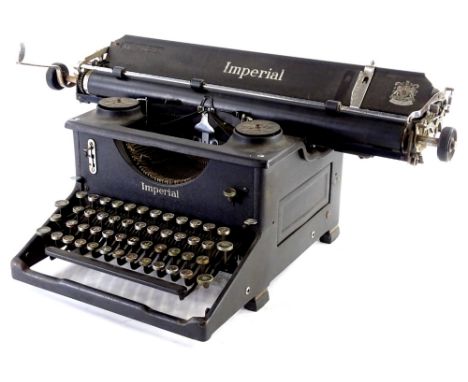 An early 20thC Imperial typewriter, with articulated keys in black and chrome coloured trim, the main body 30cm W.