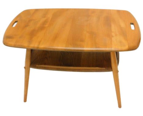 An Ercol light elm two tier coffee table, with carrying handles on turned tapering legs, 73cm W.