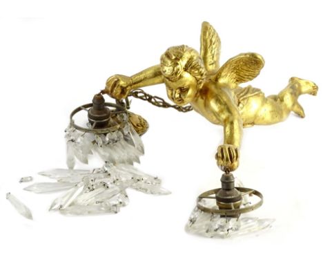 A gilt composition hanging ceiling lamp, suspended with various cut glass drops, modelled in the form of a putto, 35cm L.