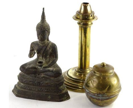 An eastern gilt metal model of a seated Buddha, on triangular base, 27cm H, a Palmer &amp; Co patent brass candle stand and a