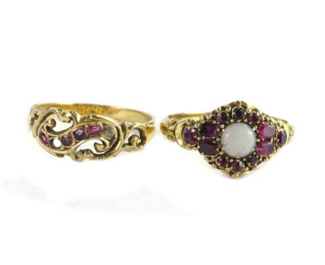 An opal and ruby mounted ring set in 18ct, and a small ruby ring. (2)