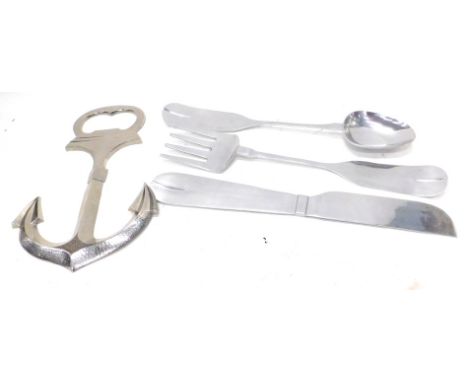 A set of four large over-sized polished aluminium advertising utensils, a fork, spoon, knife and an anchor shaped bottle open