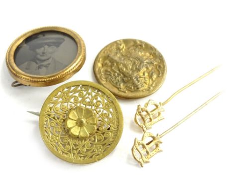 Various brooches and stick pins, to include two Victorian style gilt metal brooches, one of floral design, the other a portra