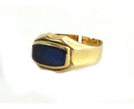 A modern design dress ring, set with rectangular dark blue design panel, on a yellow metal band, unmarked and cut, 1.7g all i