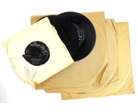 The Beatles,  45rpm vinyl records for Ticket to Ride, Day Tripper, She Loves You and A Hard Day's Night, all on parlophone an