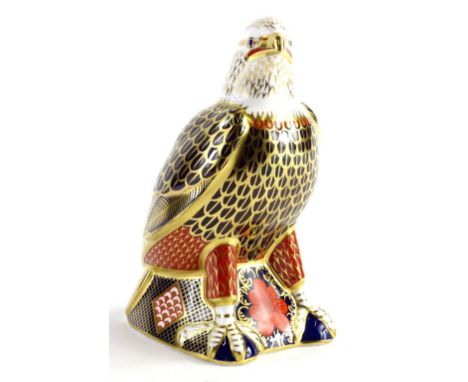 A Royal Crown Derby porcelain bald eagle paperweight, gold button to underside, boxed.