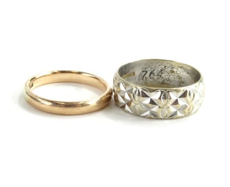 Two 9ct gold wedding bands, to include one 9ct gold wedding band, ring size M½ of plain design, the other 9ct white gold wedd