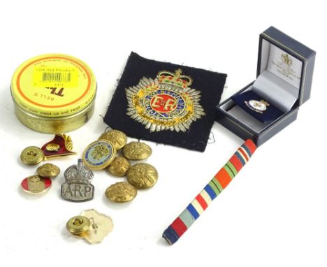Various items of militaria, to include badges, a cloth badge for the Royal Army Service Corp, etc.