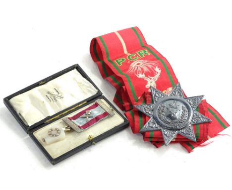 A Masonic jewel, decorated with an onyx mallet and a silver badge and sash for the ancient order of Foresters. 