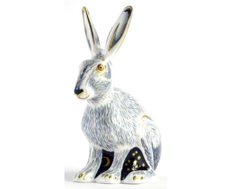A Royal Crown Derby porcelain star light hare paperweight, with octagonal gold button, boxed.