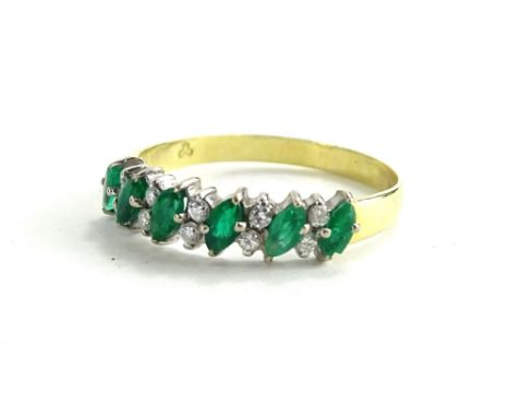 An 18ct emerald and diamond half hoop eternity ring, set with marquise cut emeralds, broken by two round brilliant cut diamon