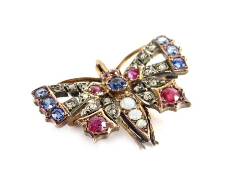 An early 20thC butterfly brooch, set with various precious stones, to include diamond, opal, sapphire, and ruby, in a yellow 