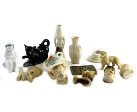 Miscellaneous items, to include clay pipes, modelled with figures, Lincoln Imp, etc., a brass plaque depicting a gentleman pl