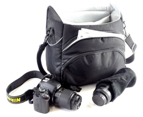 A Nikon D40 camera with lens and other lenses, etc.