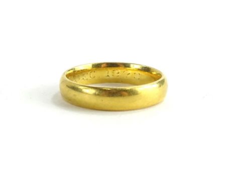 A 22ct gold wedding band, of plain design, London assay, makers stamp SS, ring size M, 4.8g.