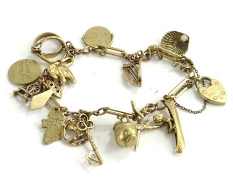 A 9ct gold charm bracelet, with heart shaped padlock engraved Love EL, on 9ct gold modern chain, with approx 15 charms, some 