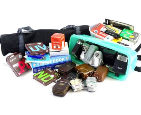 A quantity of camera accessories, films, copy of The Blue Book, 12th edition, etc.