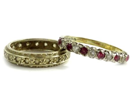 Two silver dress rings, to include one half hoop eternity ring, set with pink and white paste stones, the other an eternity r