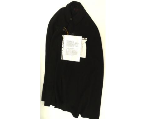 A clerical cloak, with Mowbray London label, size unknown.