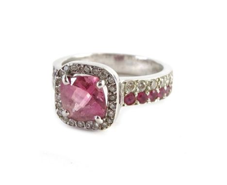 A pink sapphire and diamond dress ring, set in 18ct white gold, stamped 750.