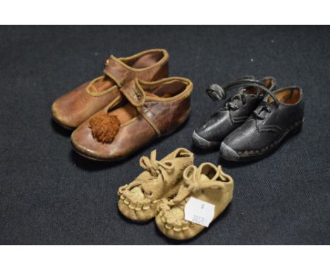 Three pairs of vintage childrens shoes including a Carley leather and button up pair, a set of miniature Lancashire style clo