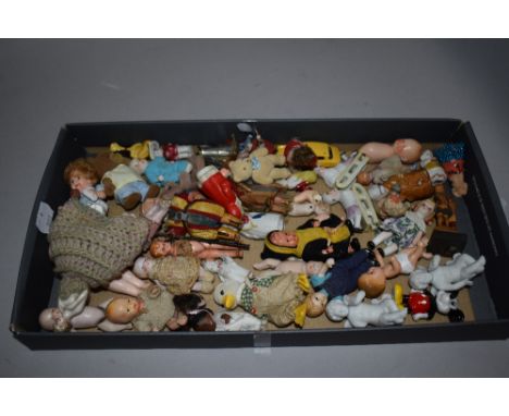 A good collection of early 20th century miniature dolls and toy figures including porcelain, celluloid and ceramic