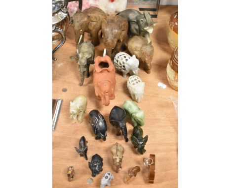 A herd of African and Indian Elephant figures including stone carved, tribal hard woods and ceramic
