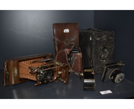 An early 20th century Compur Ensign Carbine Tropical model camera, Patheorama, VP Twin and accessories.