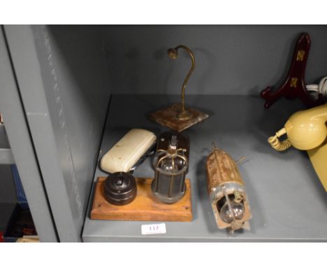 A selection of early 20th century industrial lighting including Lucas inspection light and brass safety light