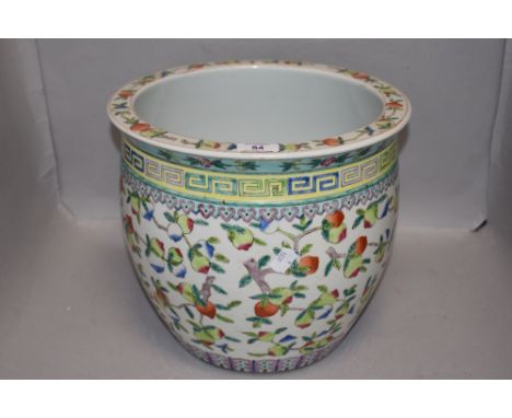 A Chinese porcelain planter decorated with fruit and Greek key boarder