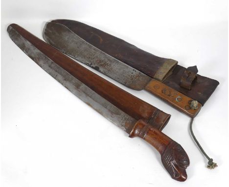 An Asian carved wooden short sword with sheath; together with a Martin Bell of Birmingham machete 