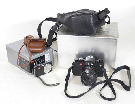A Leica R4s camera, with Leitz Elmarit - R lens, togetehr with a Leica C-Lux 2 digital camera, i  an associated Leica box