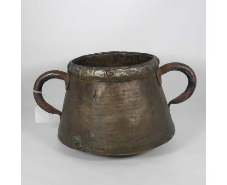 A large hand-beaten brass twin handled cooking pot, h.20cm 