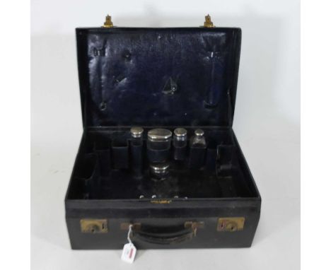 An early 20th century Mappin &amp; Webb black leather vanity case, the contents to include various silver topped glass jars, 