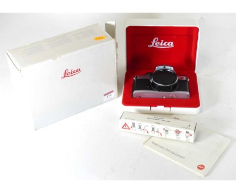 A Leica R5 camera, in original fitted box, with instructions, carrying strap, and outer cardboard boxBox is a bit scruffy but