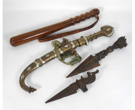 A Phurba Tibetan ritual dagger; together with another ; a wooden truncheon; and an African jambiya (4)