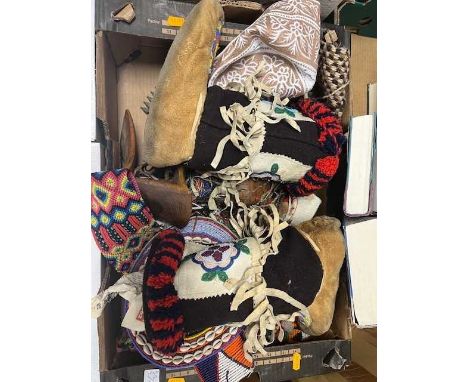 A collection of Native American items to include beaded clothing and textiles