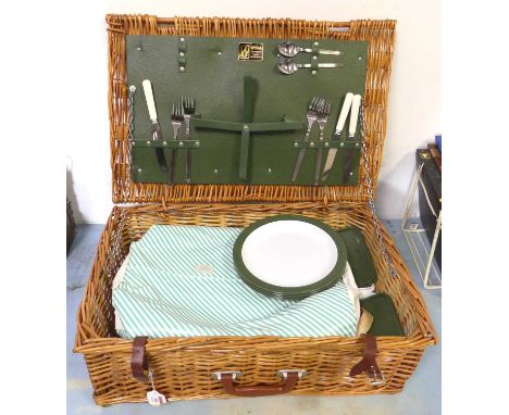 A wicker picnic hamper containing a thermos flask, plates, cool bag, cutlery etc 