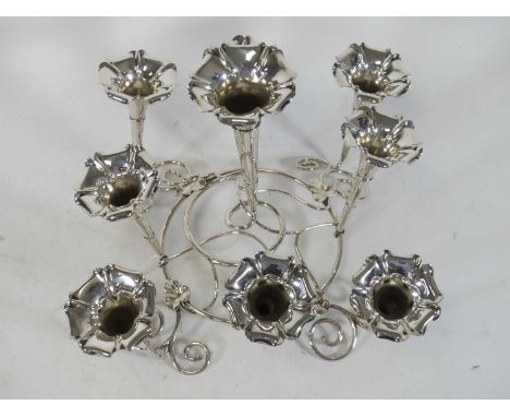 A silver plated epergne having nine trumpet shaped vases on foliate decorated support, height 25cm